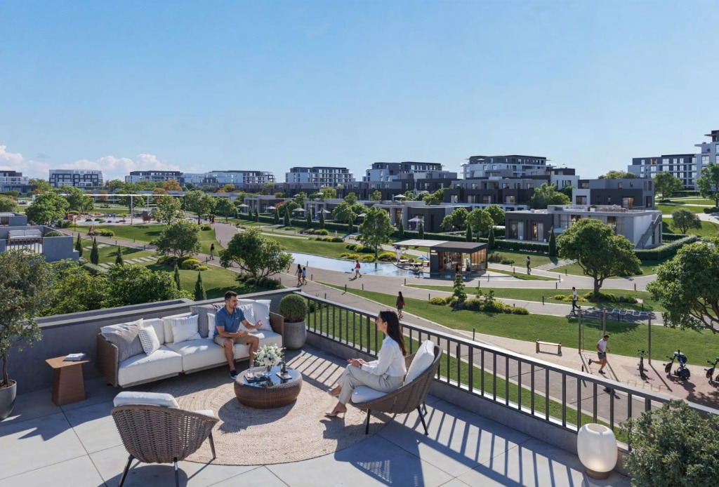 Residents relaxing on a rooftop terrace overlooking the community pool and gardens